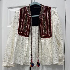 Embroidered White jacket with Red Accents. Used twice.